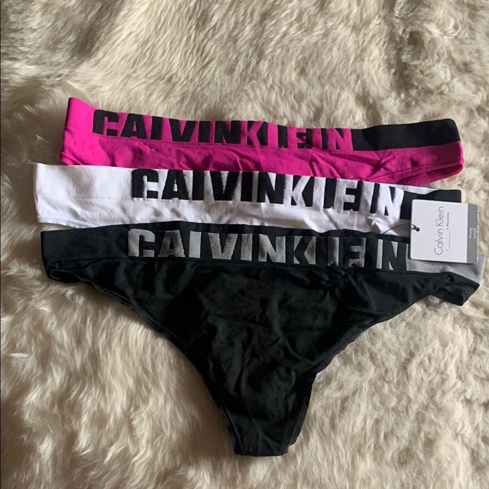 Calvin Klein Women’s Thongs Bottoms - Pink, White, and Black
Set of 3